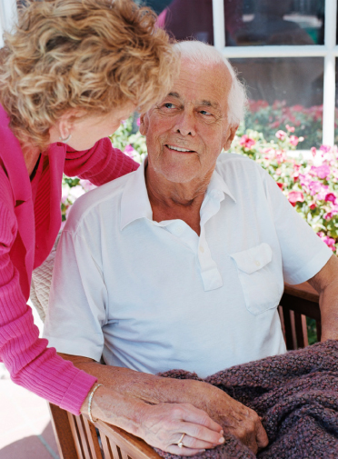 Image of a elderly man sitting in a chair